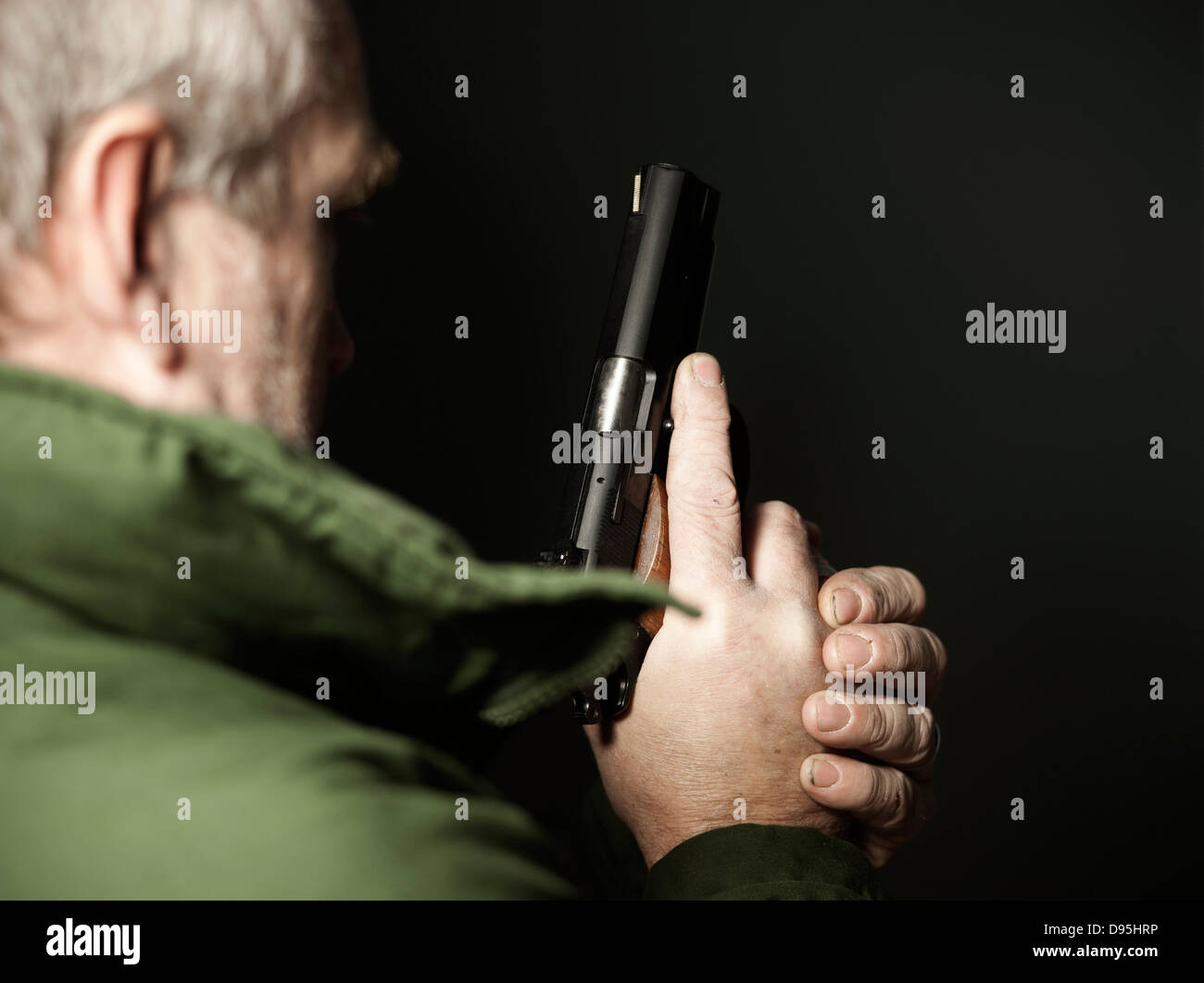 Close-up of Man with Gun, Mannheim, Baden-Wurttemberg, Germany Stock Photo