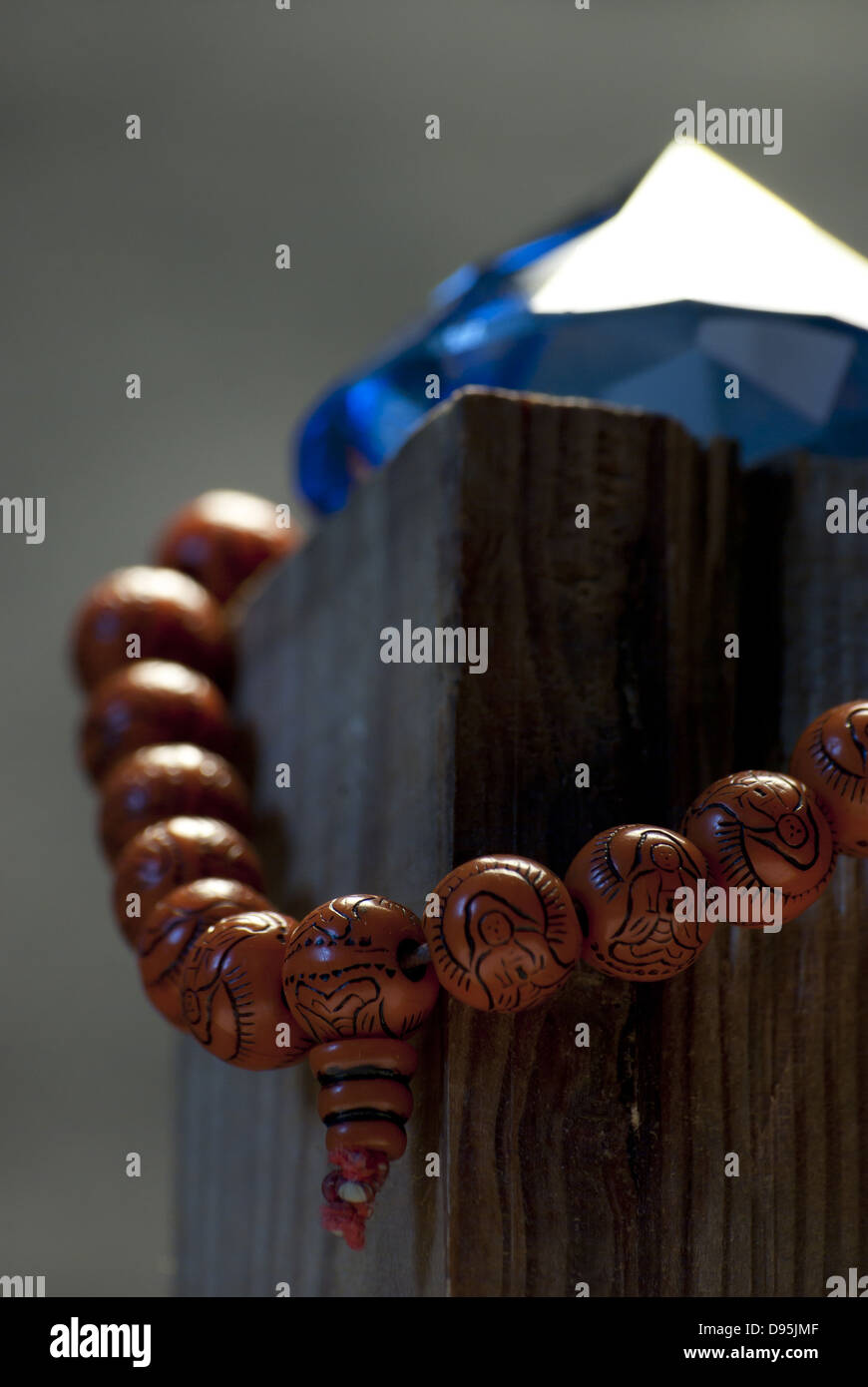 Still life with buddhist mala and blue crystal Stock Photo