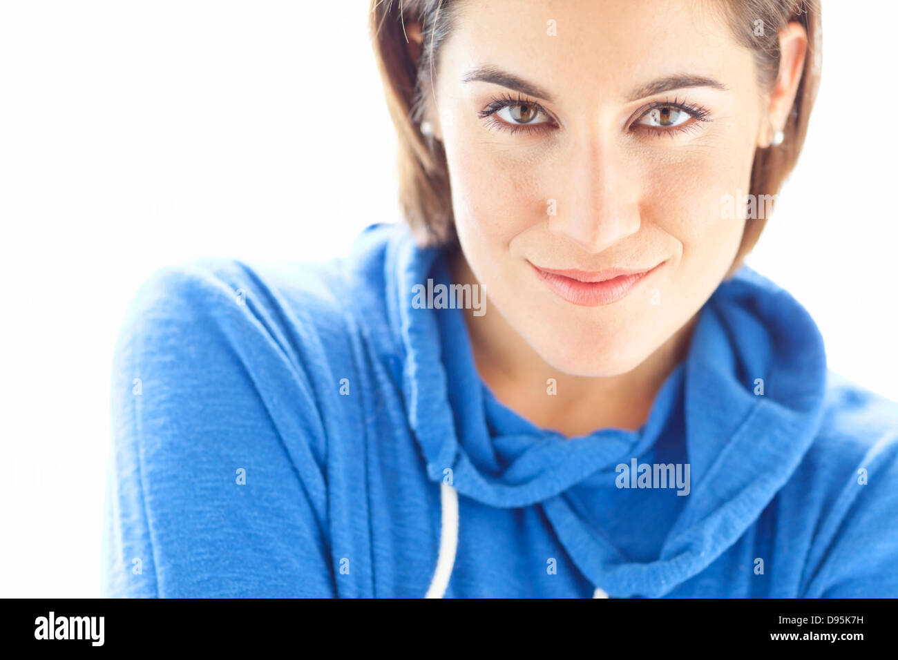 Head and Shoulders Portrait of Woman wearing Hoodie in Studio Stock Photo