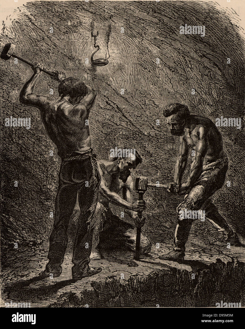 Cornish miners boring a hole to take a charge of explosive.  One miner holds the metal borer upright and the two strikers hit it with sledge hammers until the hole has been made. Cornwall, England.   From 'Underground Life; or, Mines and Miners' by Louis Simonin (London, 1869). Wood engraving. Stock Photo