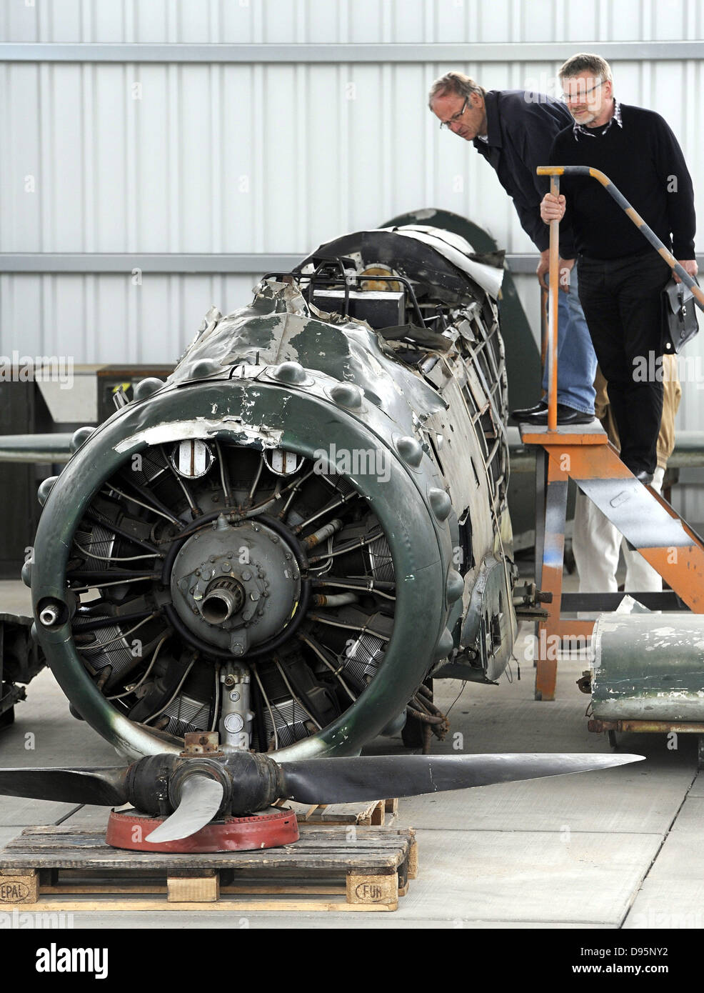 WW2 Photo of German personnel examining parked plane. WW2 Photo of German personnel examining parked plane.