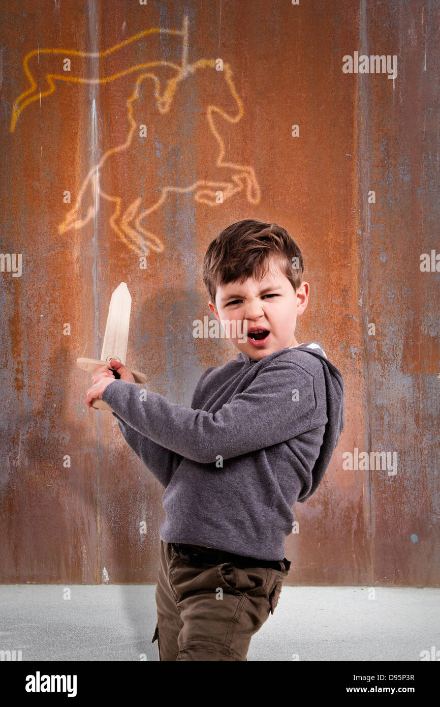 Germany, Brandenburg, Boy holding sword Stock Photo