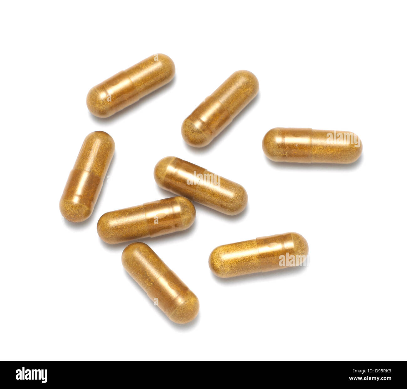 brown capsules cut out onto a white background Stock Photo