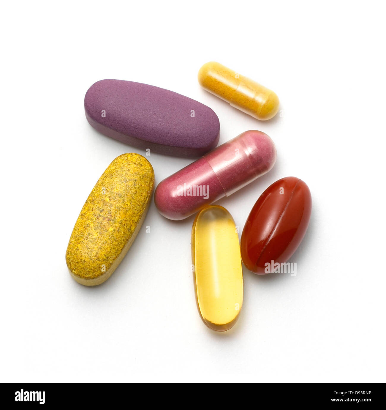 mixed pills and tablets cut out onto a white background Stock Photo