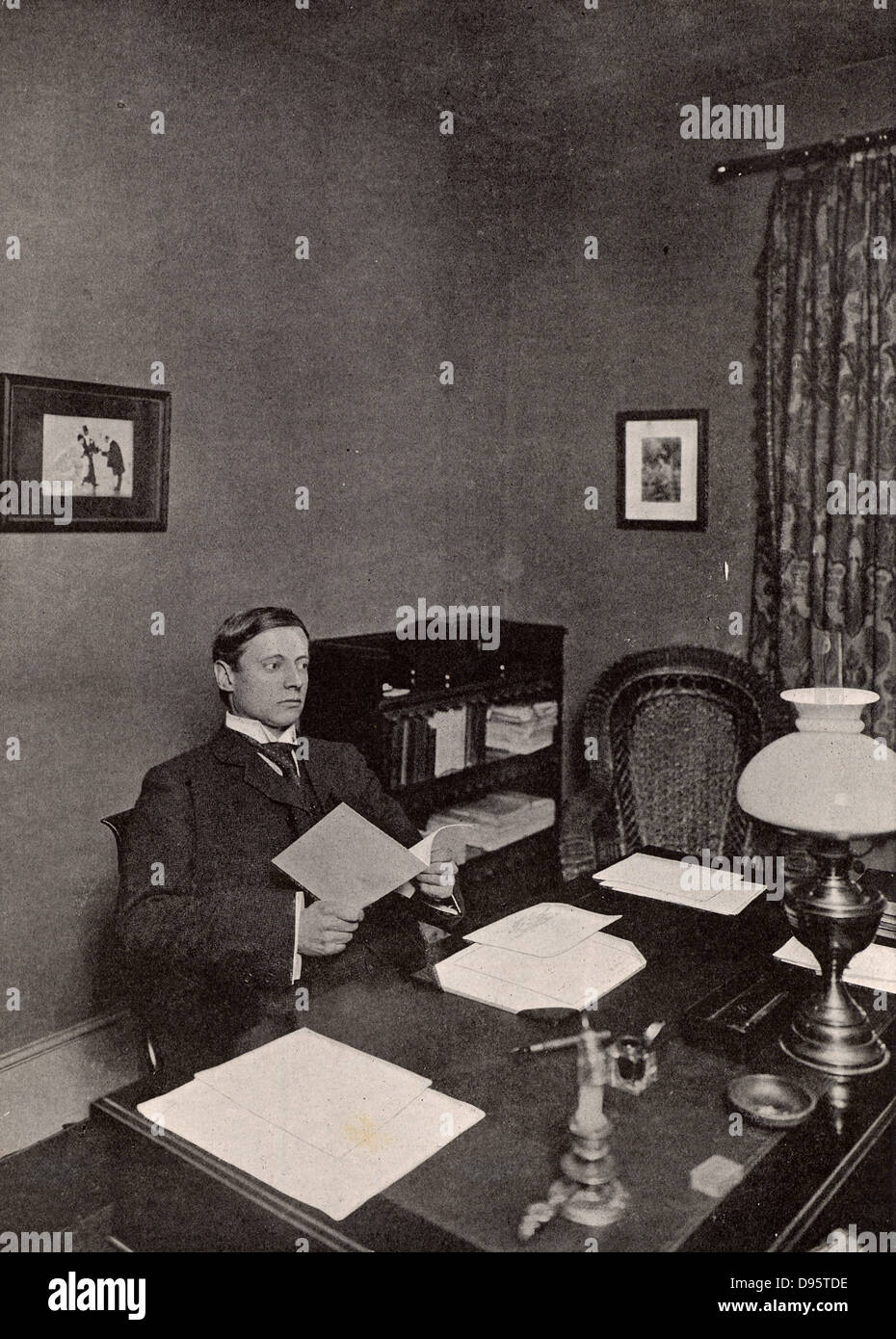 WW Jacobs. Wiliam Wymark Jacobs (1863-1943) English short story writer, born at Wapping, London, best remembered for his short stories which ranged from the humorous to the macabre such as 'The Monkey's Paw'.  Jacobs in his study at Buckhurst Hill, Essex, England. Stock Photo