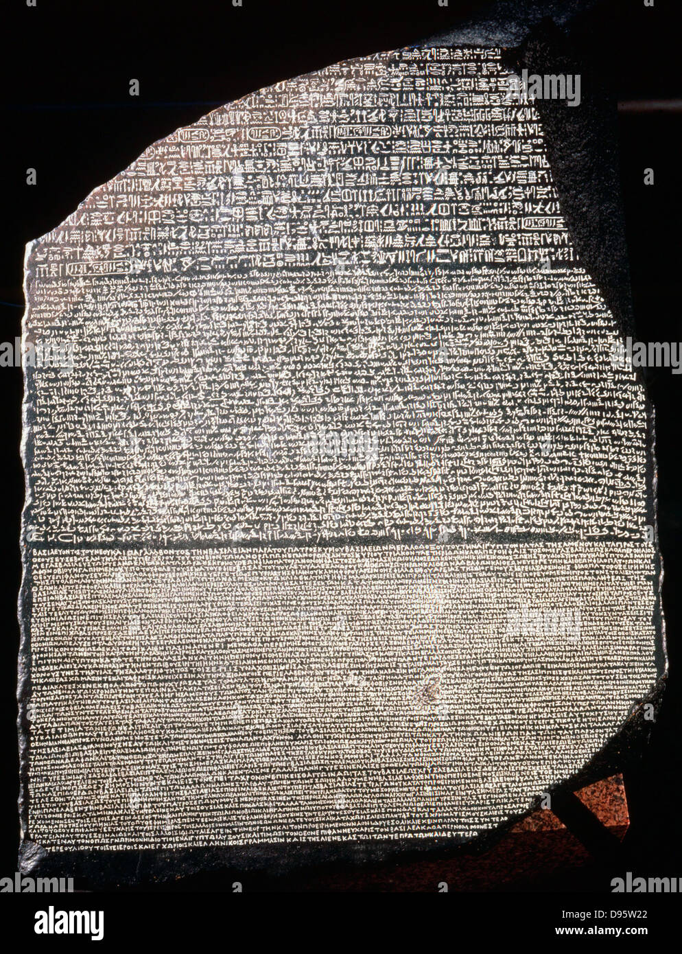 Rosetta Stone: Basalt slab inscribed with decree of pharaoh Ptolemy Epiphanes (205-180 BC) in three languages, Greek, Hieroglyphic and Demotic script. Discovered near Rosetta in Egypt in 1799, became key to deciphering Egyptian inscriptions British Museum Stock Photo