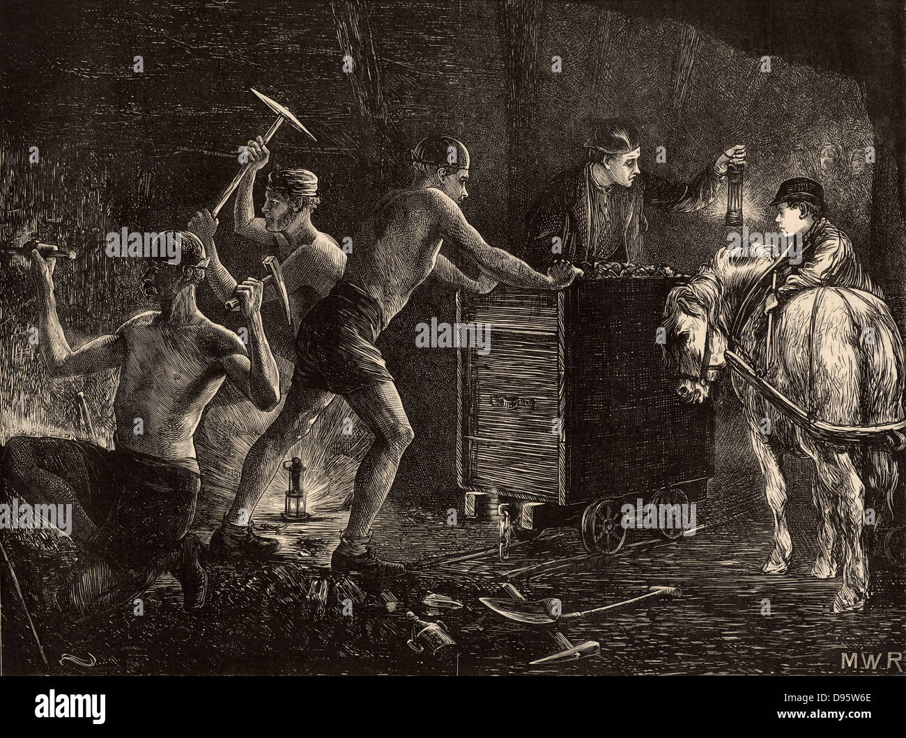 South Durham miners or pit-men at work at the coal face. On the floor, centre left, is a Clanny safety lamp which had a thick glass round the flame, while on the right the miner is holding up a Davy lamp which had wire gauze round the flame. On the right the boy with a pit pony is waiting for the miners to fill the wagon with coal so that he can hitch up the pony which will drag the wagon along the rails to the bottom of the pit shaft. Engraving from 'The Graphic' (London, 28 January 1871). Stock Photo