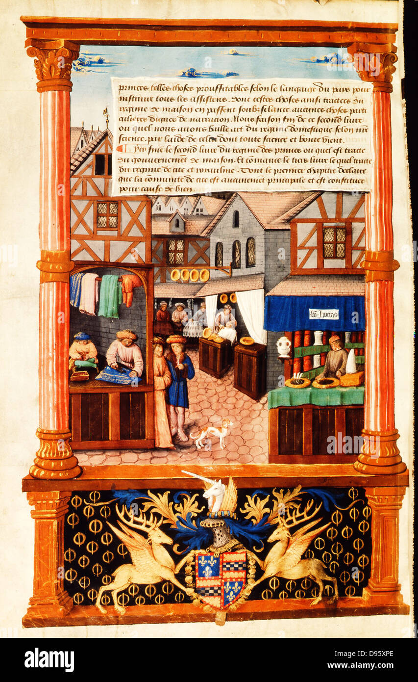 A street of shops including a tailor and a barber. This image is set in Paris but is typical of similar activities in cities in England and Europe. Note the cobbled street, half-timbered buildings, and the diamond-paned windows.  Early 16th century French manuscript. Stock Photo
