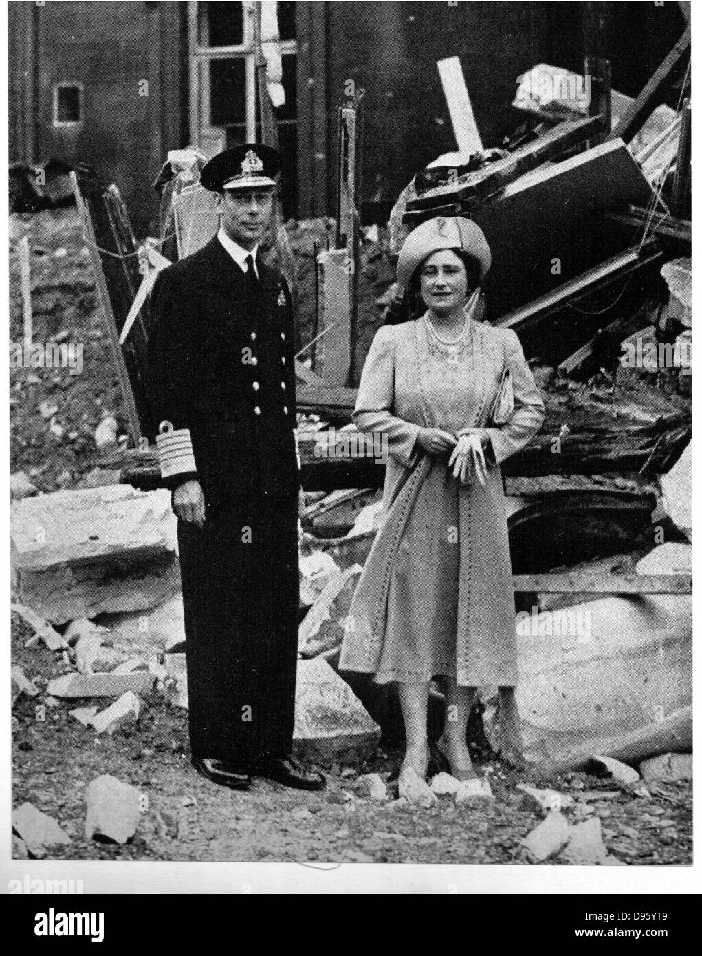 George VI (1895-1952) and Queen Elizabeth (1900-2002) standing among the bomb damage at Buckingham Palace, London.  During the Blitz, the German bombing of London in World War II, between 7 September 1940 and 10 May 1941 the Palace was bombed seven times. Stock Photo
