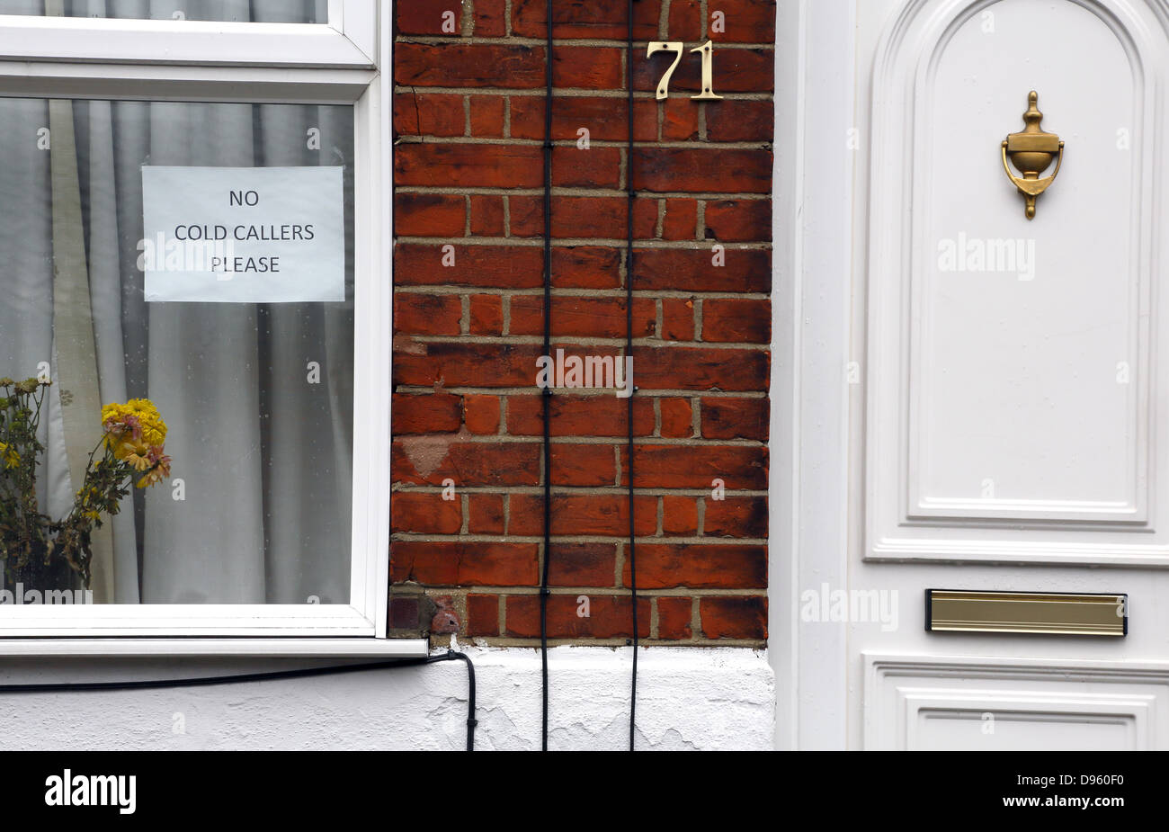 No cold callers sign on a window of a house. Stock Photo