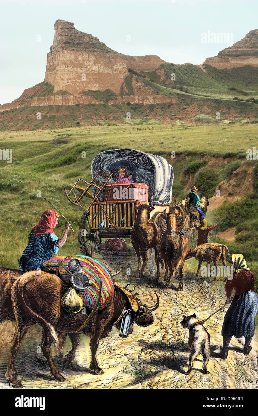 Covered wagon of a homesteader family heading west with their belongings. Hand-colored woodcut combined with a photograph Stock Photo