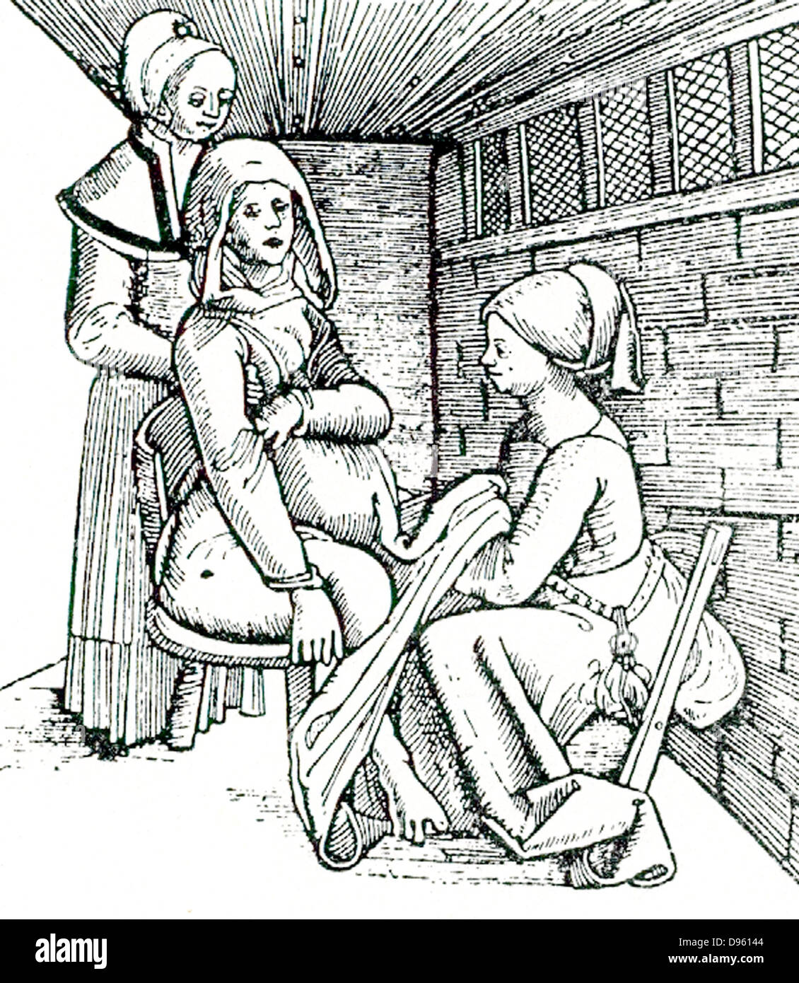 Birthing chair in use. Midwife works underneath the mother's clothing while her assistant supports the mother from behind. 16th century woodcut from Eucharius Roslin 'The Garden of Roses'. Stock Photo