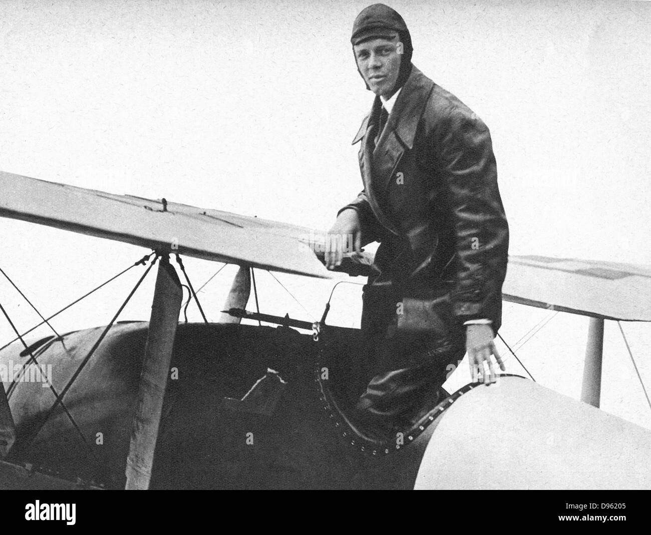 Charles Lindbergh (1902-1974) in his flying kit standing in 'Spirit of St Louis', the plane in which he made the first non-stop Atlantic air  crossing: 20-21 May 1927. Landed at Le Bourget Airdrome, Paris, after a flight of 33.5 hours. Stock Photo
