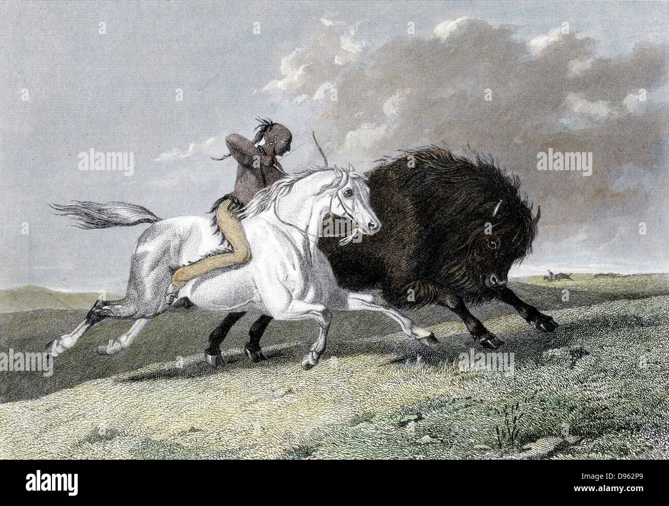 North American Indian, mounted on horse, hunting buffalo (Noth American Bison) with a bow and arrow. Hand-coloured engraving 1861. Stock Photo