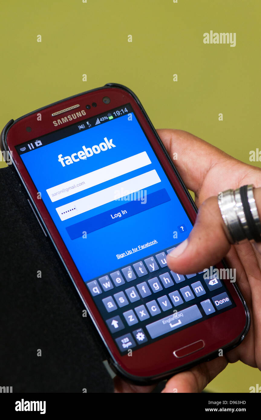 Facebook login screen on mobile phone Stock Photo