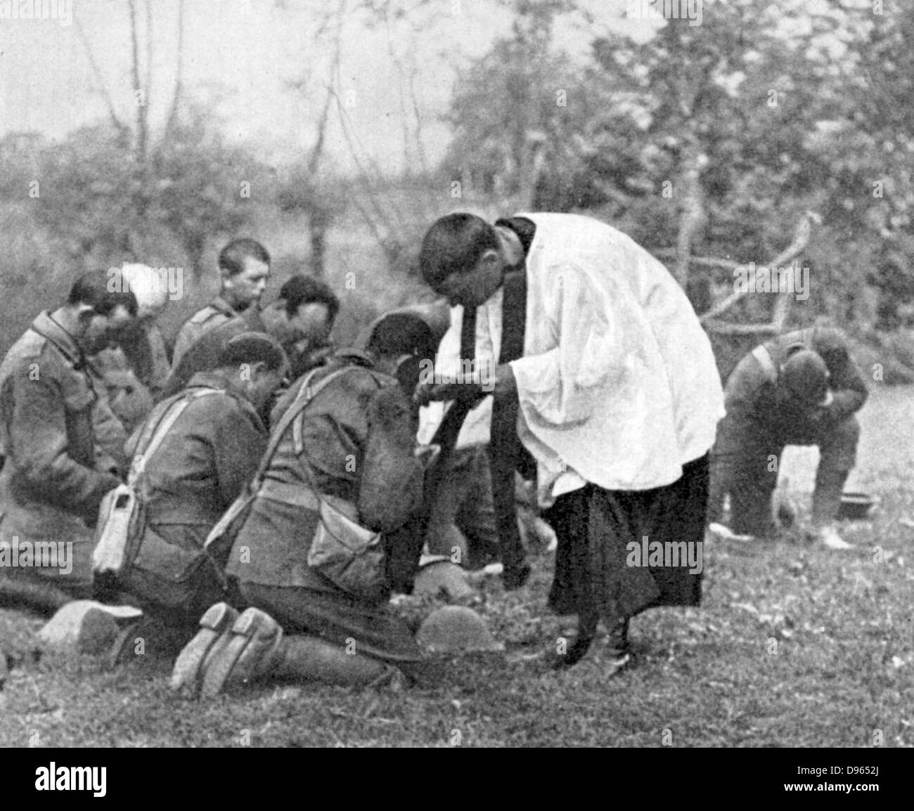 World War I: New Zealand troops taking Holy Communion administered by an Army chaplain in the open air. Stock Photo