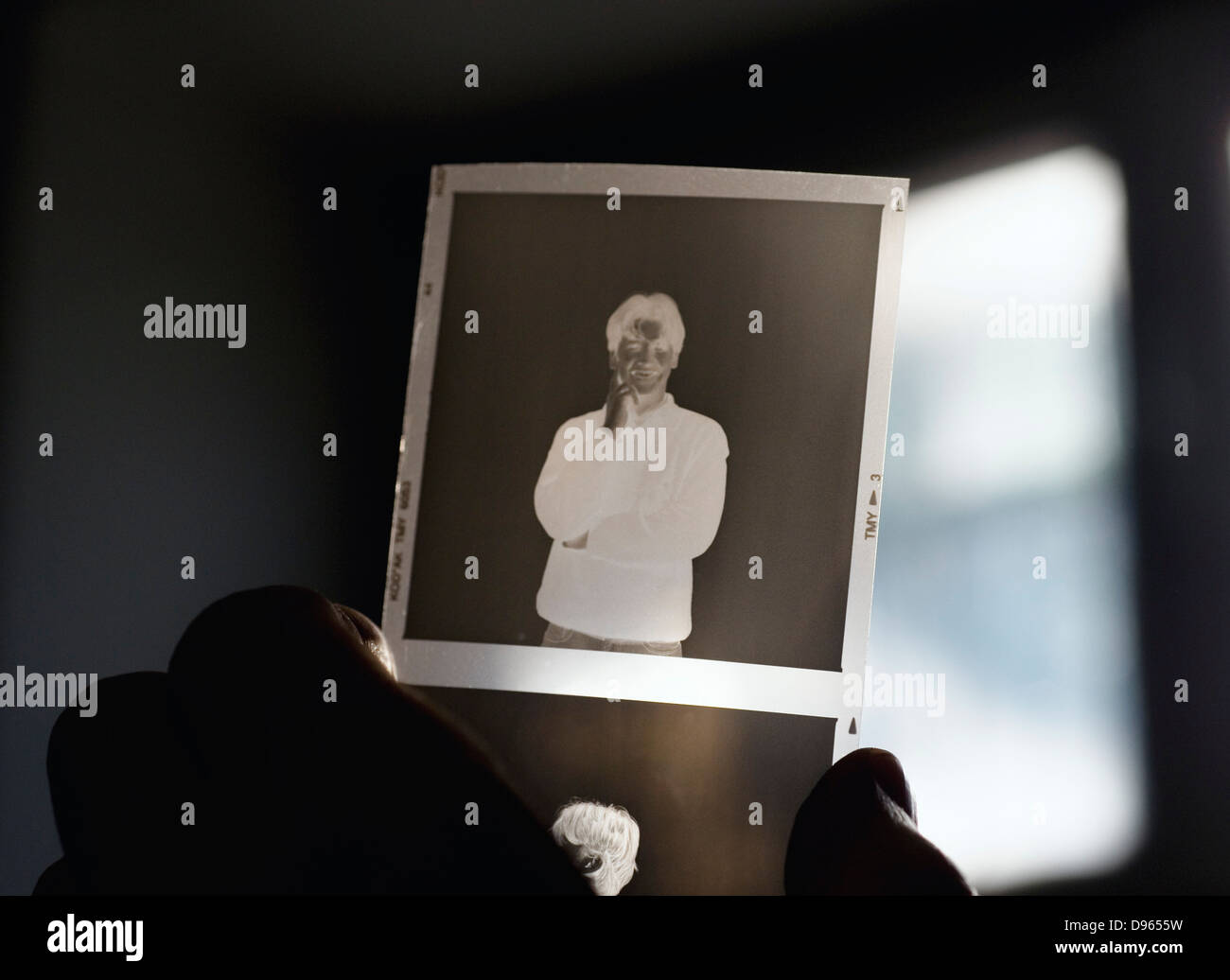 holding medium format negative bw film Stock Photo Alamy