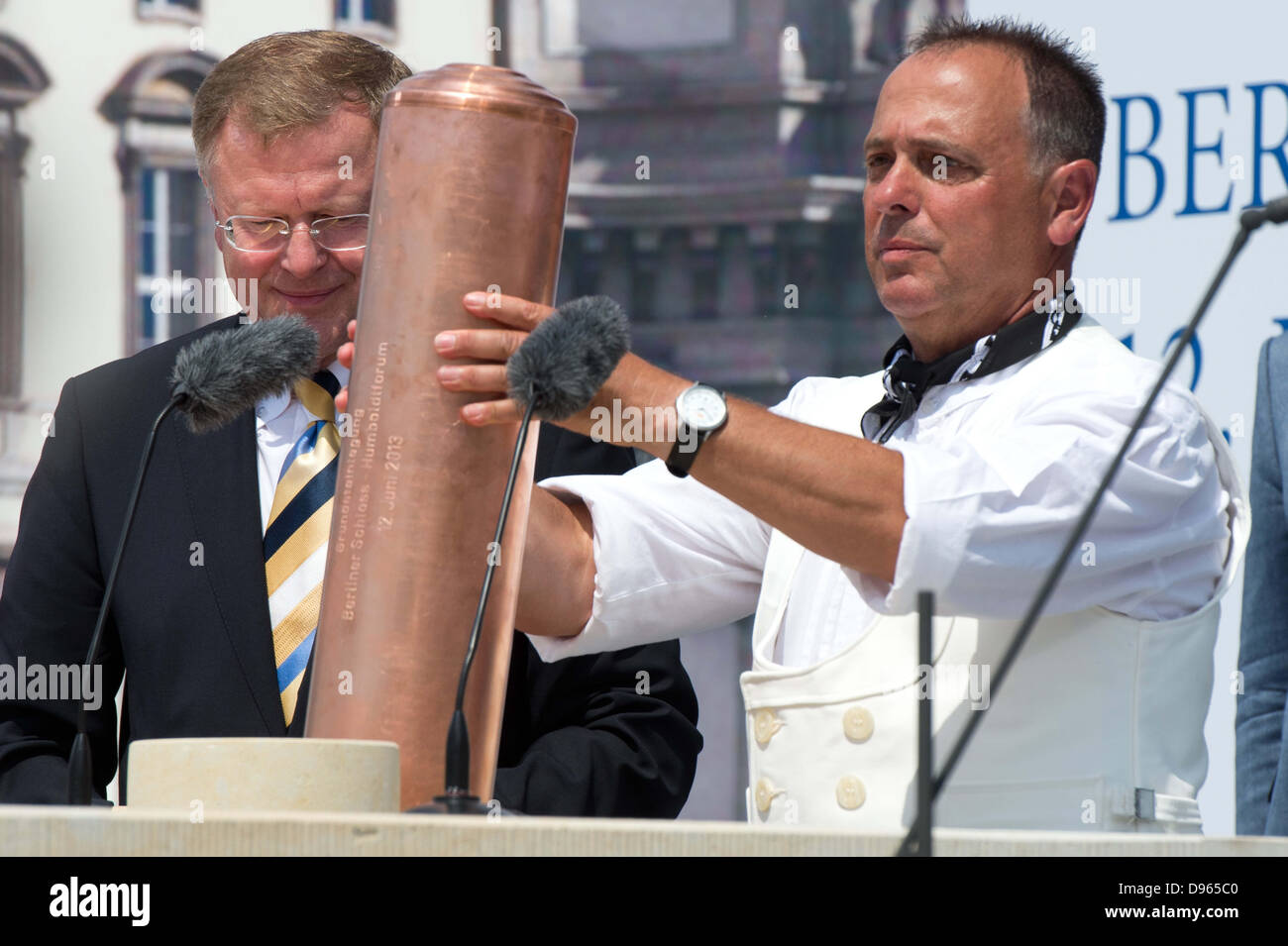 Foreman Harald Eberhardt lays a capsule in the foundation stone for the Berlin Palace in Berlin, Germany, 12 June 2013. Photo: MAURIZIO GAMBARINI Stock Photo
