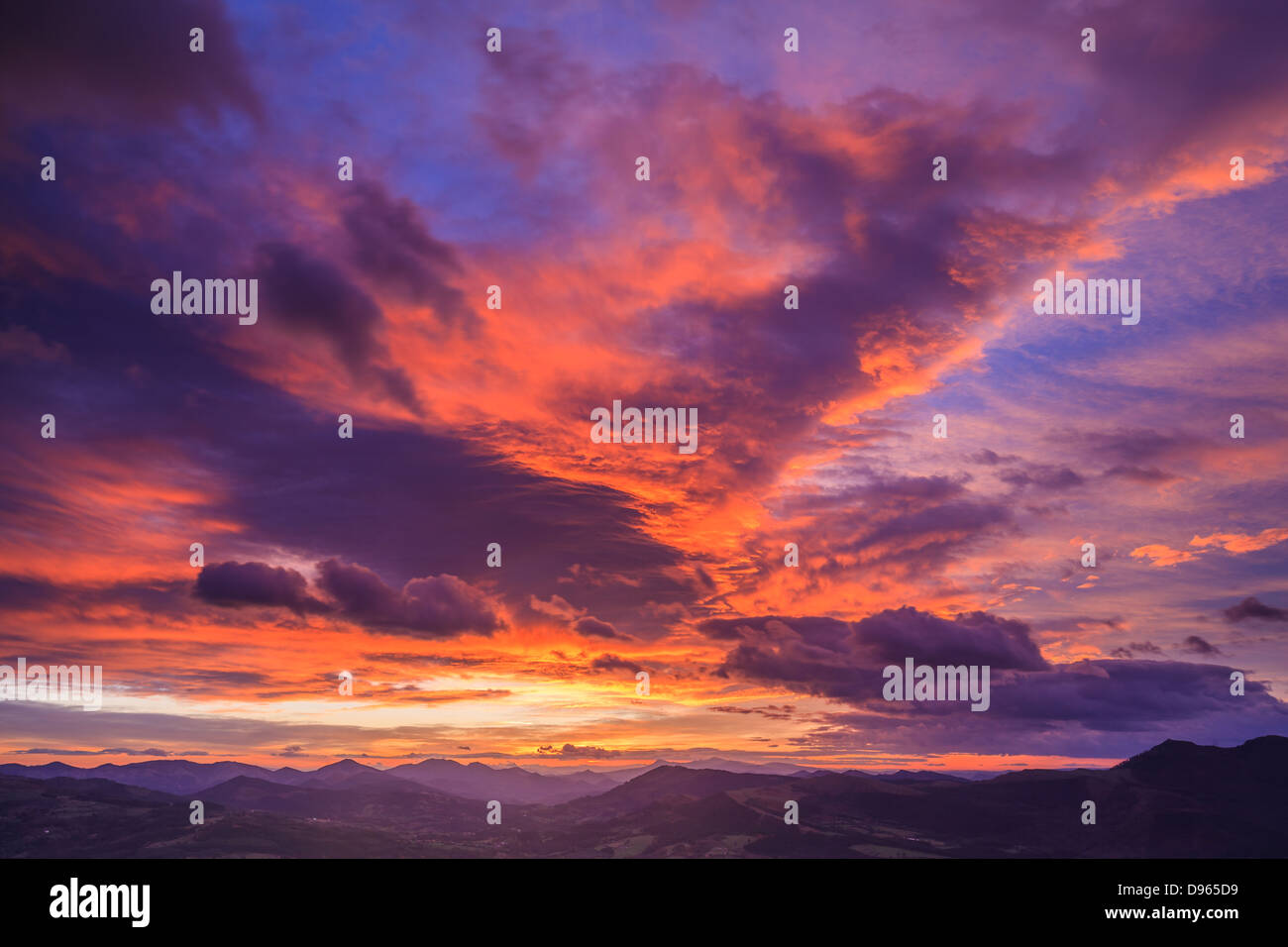 Landscape with cloudy sky on sunrise, Encartaciones, Bizkaia, Spain Stock Photo