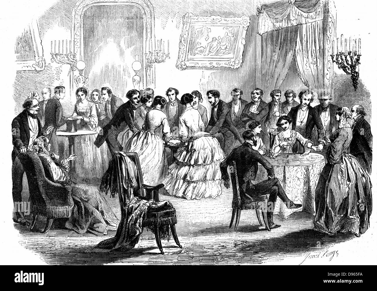 Spiritualist meeting in a Paris drawing room. Communicating with the 'other side' by means of  the hat, table-turning, and the pendulum. From 'L'Illustration' (Paris 1853). Wood engraving. Stock Photo
