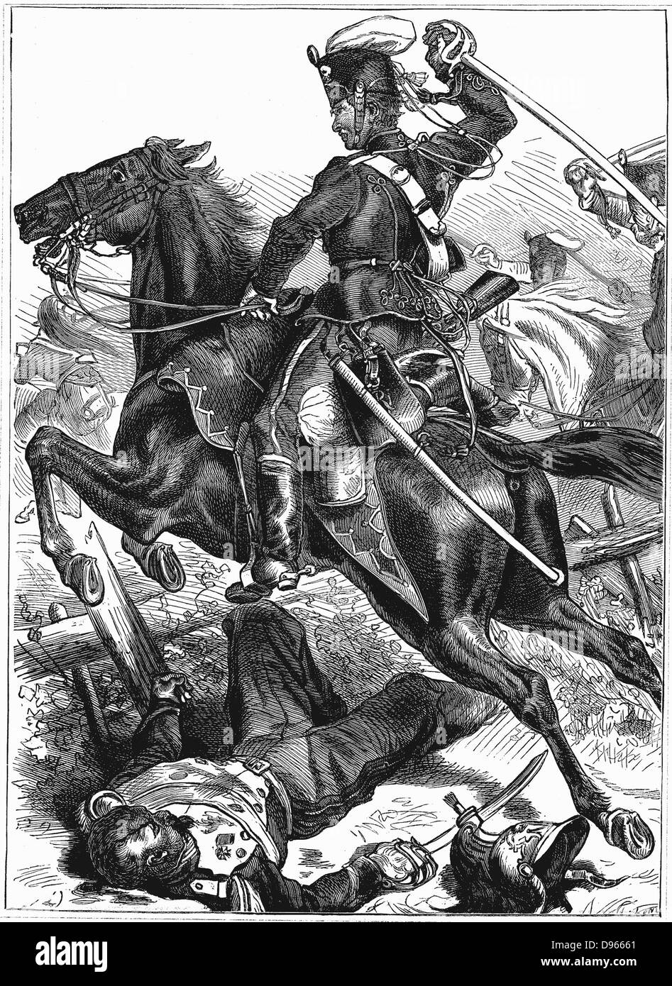 Franco-Prussian War 1870-1871: Prussian Hussar charging with sword drawn. Wood engraving. Stock Photo