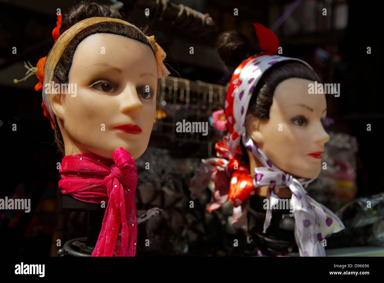 Thai Chinatown market in Bangkok face mannequins on stall Stock Photo