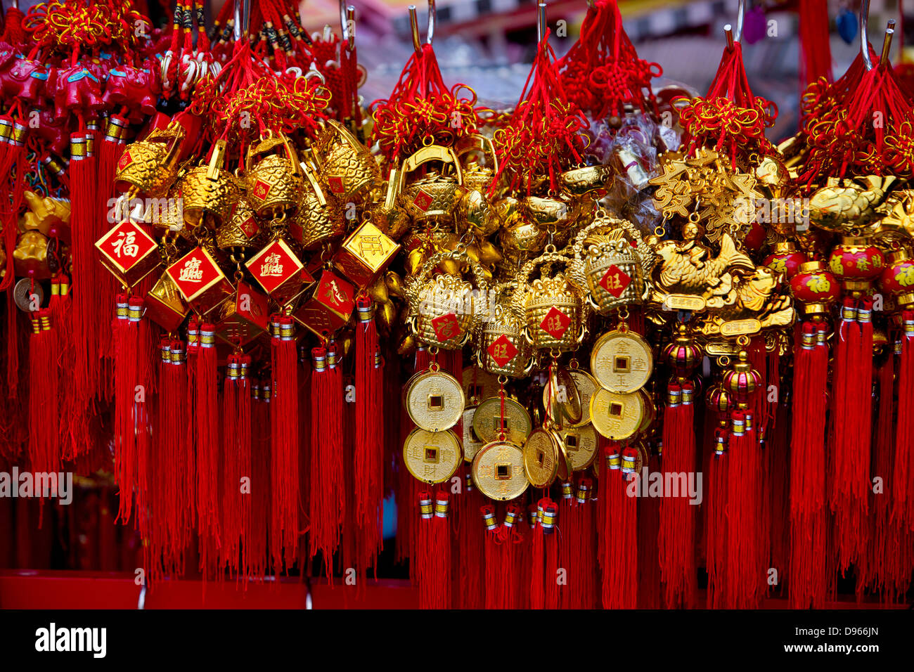 Red & gold lucky charms in the New Year Celebrations in Bangkok’s Chinatown Stock Photo