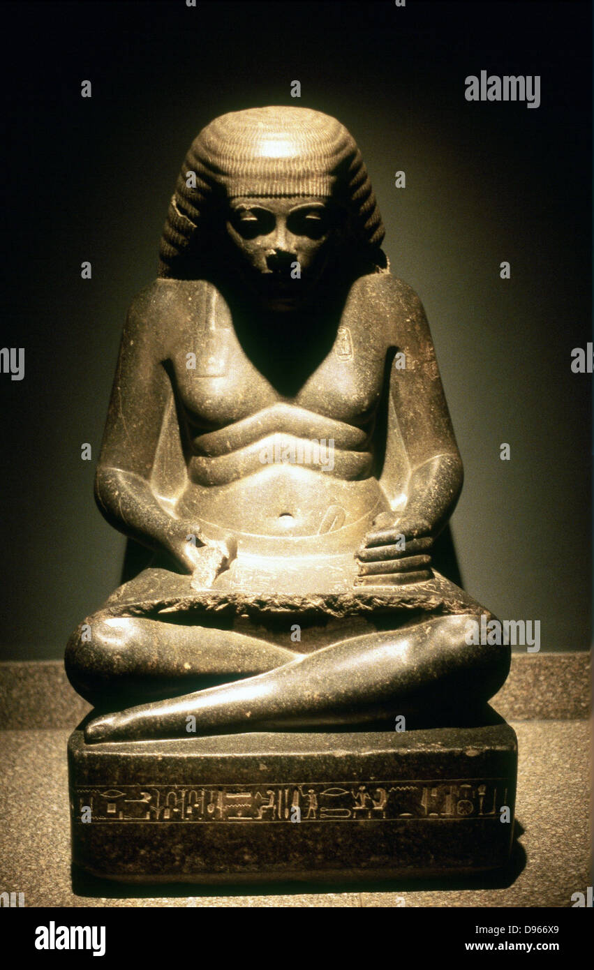 Ancient Egyptian scribe, seated. Granite statue from Karnak, 17/18th