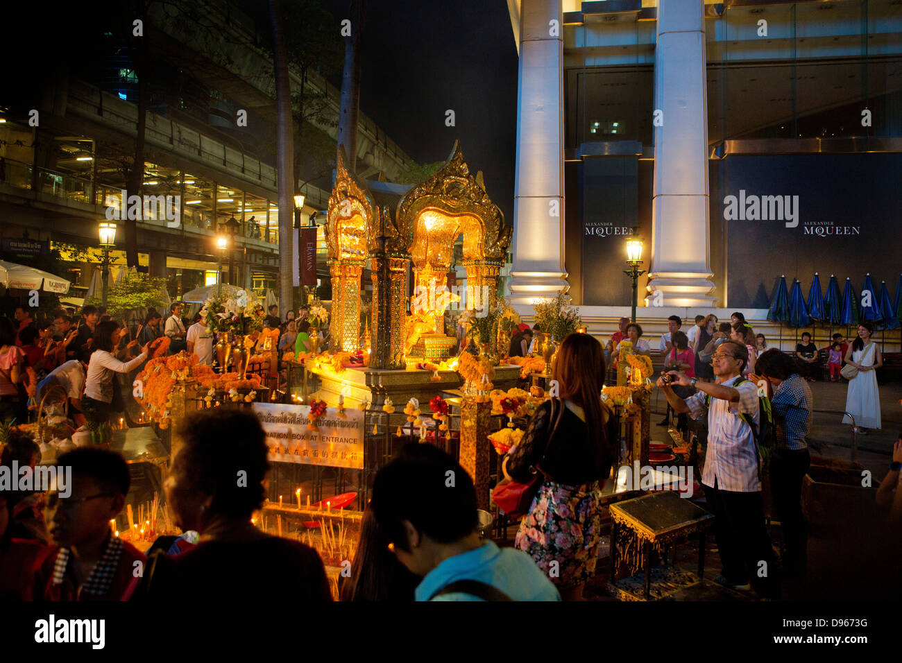 Worshipers in the Erawan Shrine, Bangkok. Stock Photo