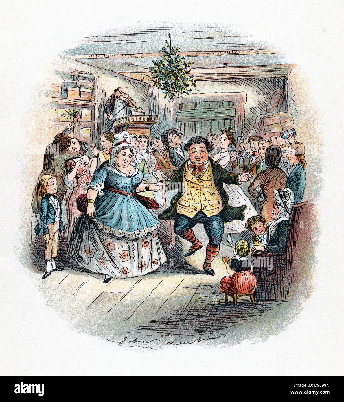 Mr Fezziwig's Ball, illustration by John Leech for  'A Christmas Carol' by Charles Dickens( London,1843). This novella was the earliest and most popular of Dickens' Christmas stories. Scene from the end of the book shows jollity and bonhomie, with fiddler (violinist) playing for dancers. Kissing under mistletoe, left,  and evergreen decoration hanging from ceiling are vestiges of pre-Christian winter rites. Stock Photo