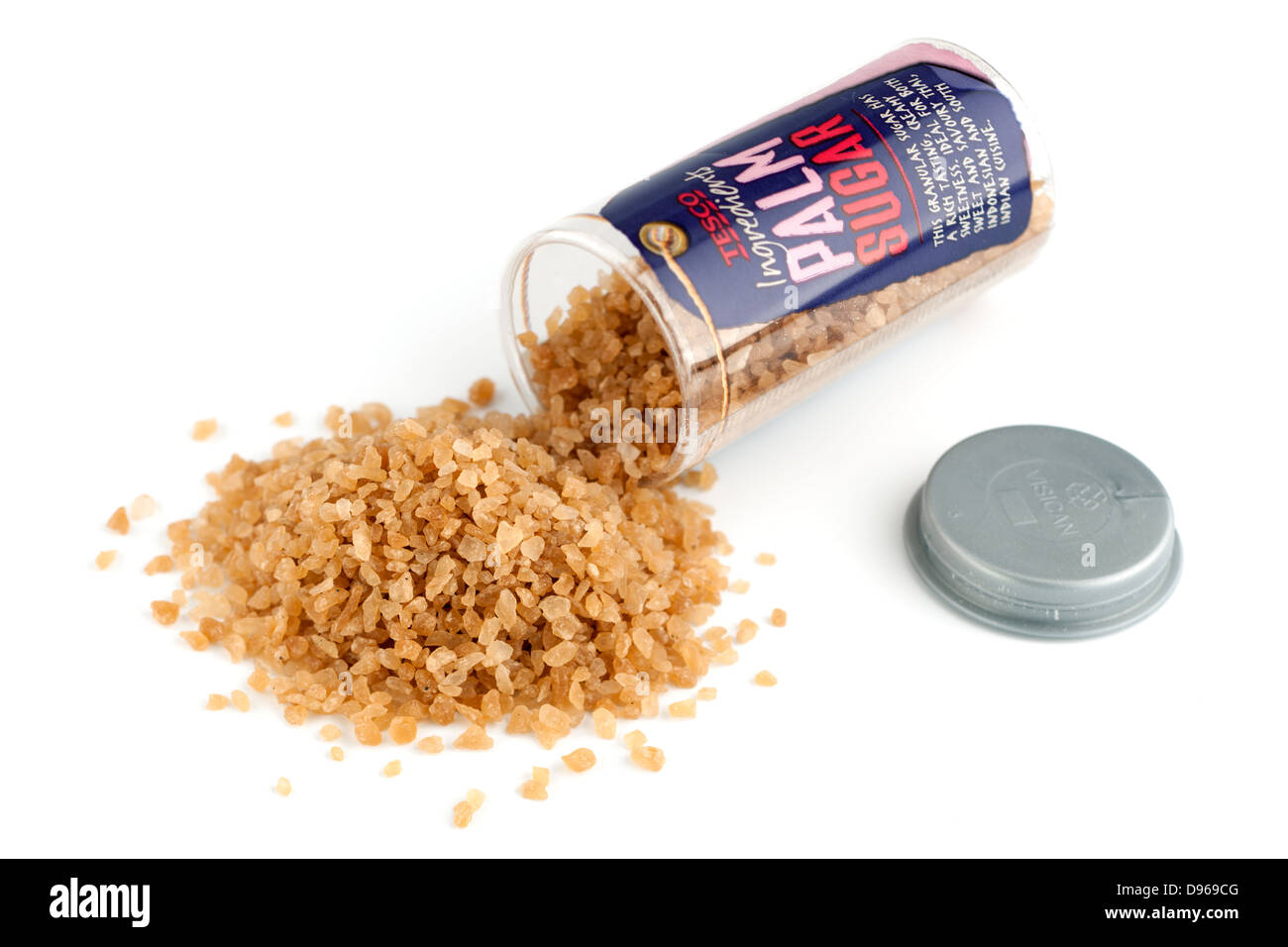 Container spilling palm sugar crystals Stock Photo