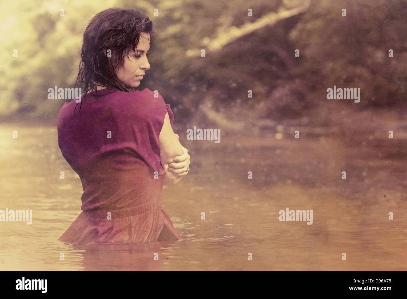 Woman in dress wading in water hi-res stock photography and images - Alamy
