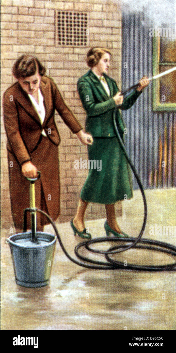 Air Raid Precautions': Set of 50 cards issued by WD & H0 Wills, Britain 1938, in preparation for the anticipated coming of World War II. Women fighting fire with stirrup hand pump. Stock Photo