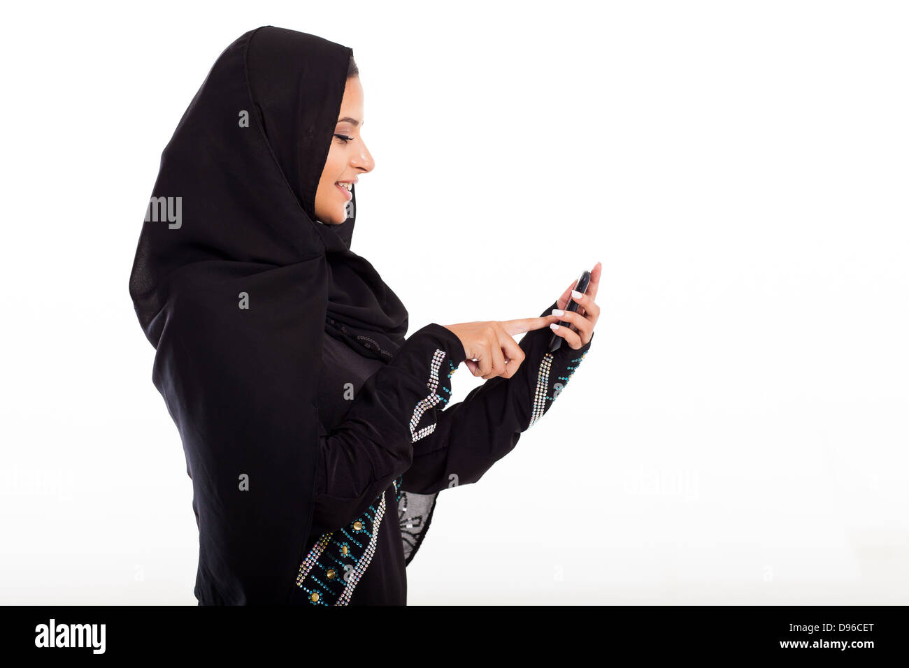 modern Arabian girl using smart phone isolated on white Stock Photo