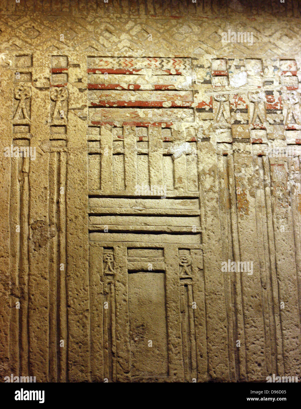 False door of Tjetji and his wife Debet. Limestone, Fourth or Fifth Dynasty, about 2500-2400 BC. From the tomb of Tjetji at Giza. This door comes from the same tomb. False doors were the main place for making offerings in the Old Kingdom. One of the dead person's spirits would pass through the door between the worlds of the dean and the living. The Central panel of this door shoes Tjeji and Debet receiving offerings, They appear on the side panels with their children. Stock Photo