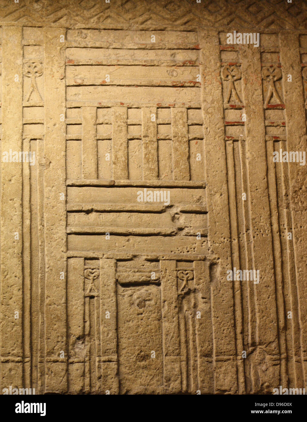 False door of Tjetji and his wife Debet. Limestone, Fourth or Fifth Dynasty, about 2500-2400 BC. From the tomb of Tjetji at Giza. This door comes from the same tomb. False doors were the main place for making offerings in the Old Kingdom. One of the dead person's spirits would pass through the door between the worlds of the dean and the living. The Central panel of this door shoes Tjeji and Debet receiving offerings, They appear on the side panels with their children. Stock Photo