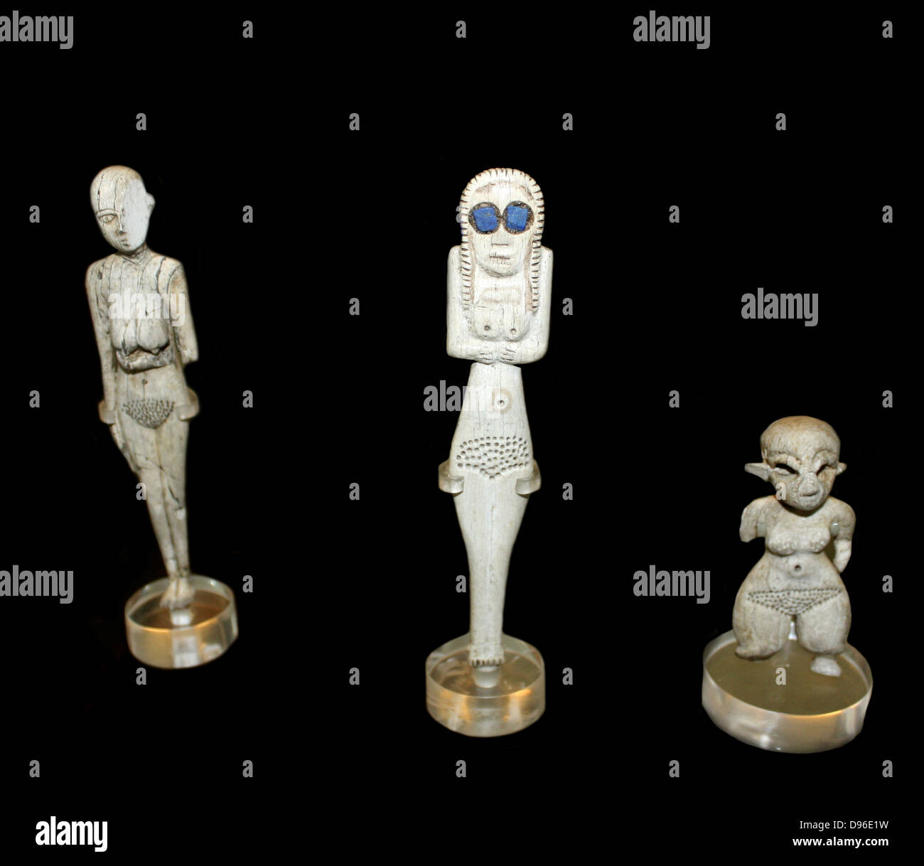 Figurines of bone and ivory. Predynastic, Naqada I. 4000-3600 BC. Ivory and bone figures of this type first appeared in the Naqada I period and continued into Naqada II. The inlaid eyes in one example are of lapis-lazuli may be a later addition. Stock Photo