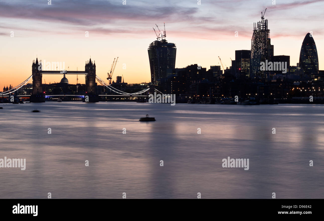 Night shot of Tower bridge and the city of London Stock Photo