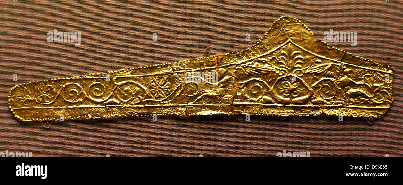 Gold pediment-shaped diadems 330-300 BC. These diadems are made of thin sheet gold with die-formed designs. The most elaborate of them has a central palmette and winged figures on either side with scroll work beyond. The Kyme Treasure contained fragments of at least 11 such diadems: they were probably made especially for the tomb. Stock Photo