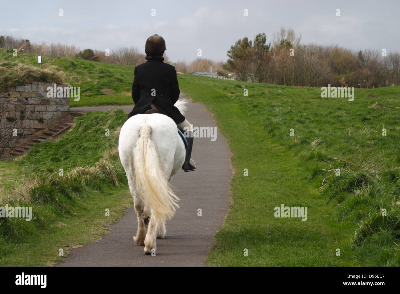 A woman riding a horse in Berwick Upon Tweed, shortly after the Riding