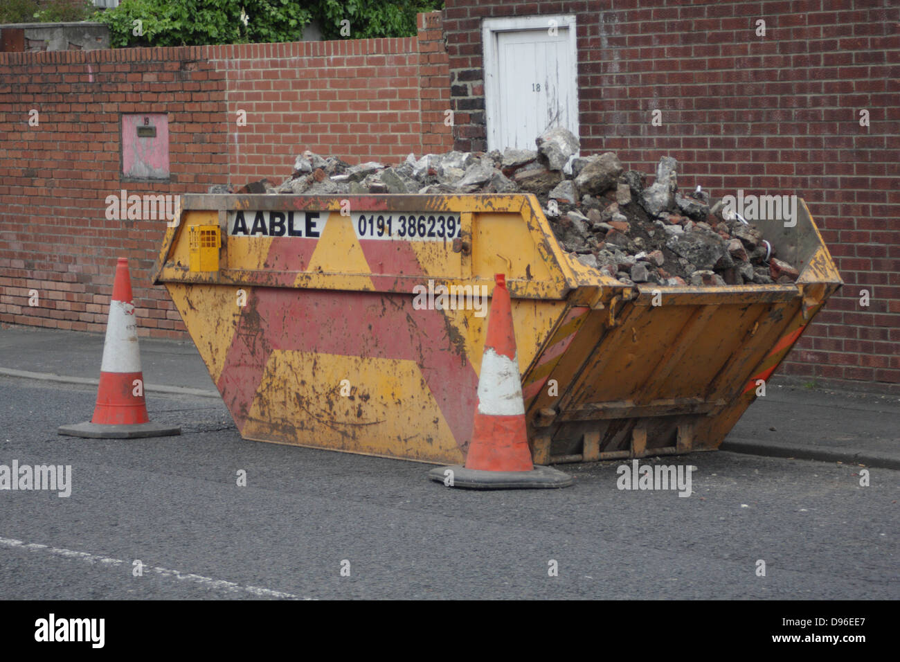 A skip full of building rubble, bricks, cement etc Stock Photo Alamy
