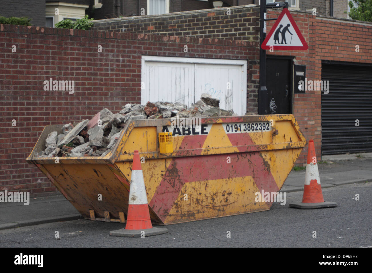 A skip full of building rubble, bricks, cement etc Stock Photo Alamy