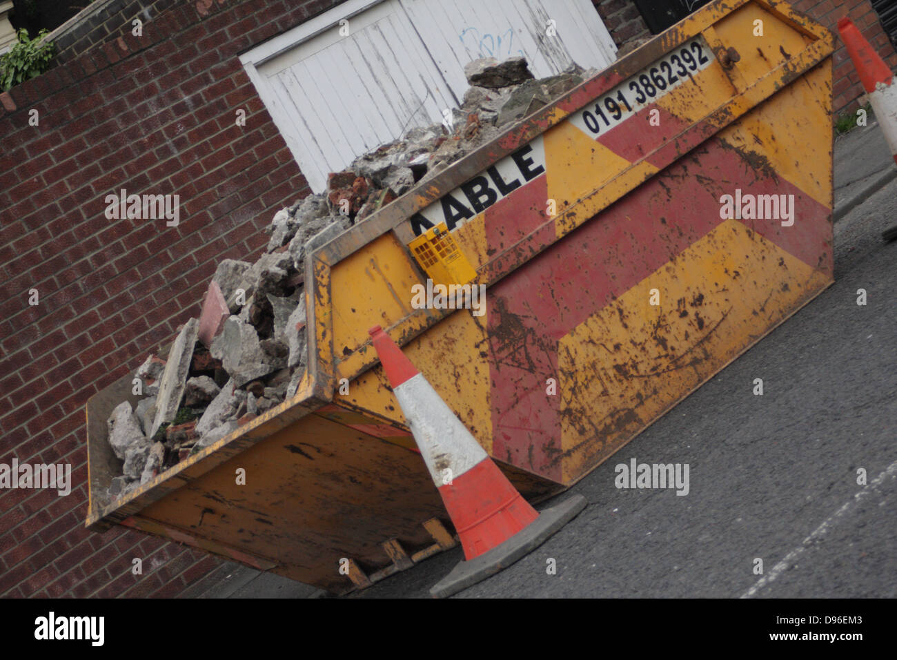 A skip full of building rubble, bricks, cement etc Stock Photo Alamy