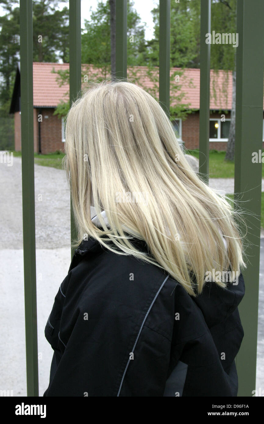 A young girl outside a youth detention center on Ekerö outside Stockholm, Sweden Stock Photo