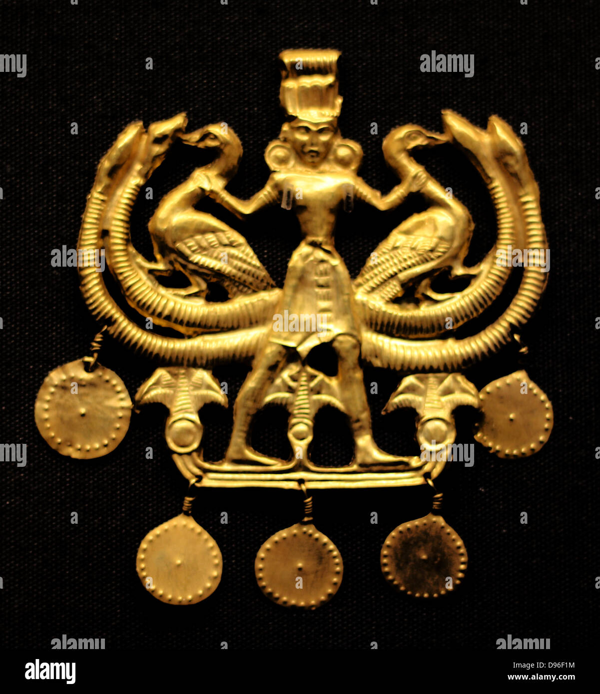 Ancient Greek 'Palace Age' Minoan Gold pendant. Circa 1850-1550 BC. From the Aegina treasures held at the British Museum, London. Originally from Aegina, off the south coast of Greece Stock Photo