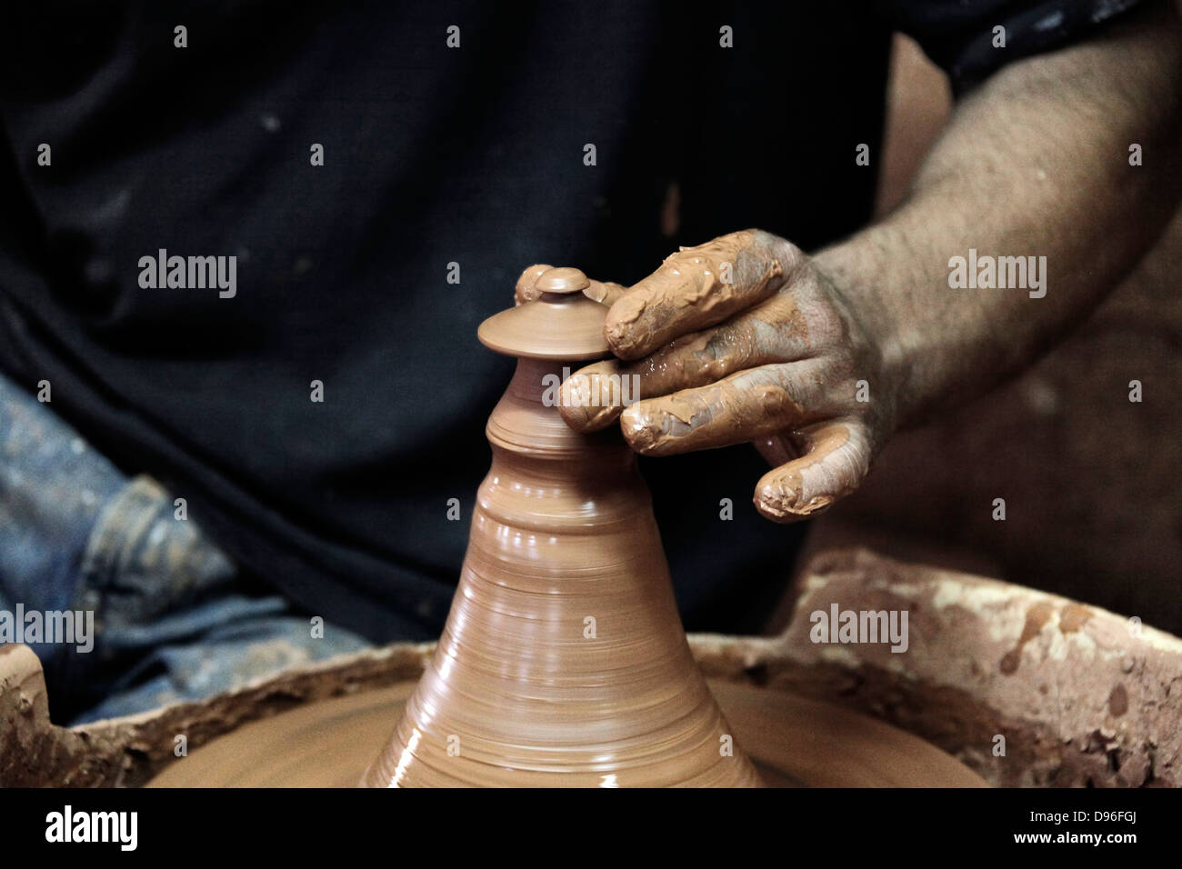Man working with clay Stock Photo