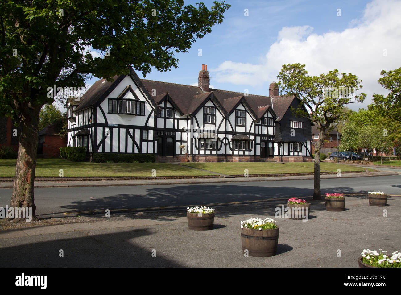 Village of Port Sunlight, England. Picturesque early summer view of houses in Port Sunlight’s Bridge Street. Stock Photo