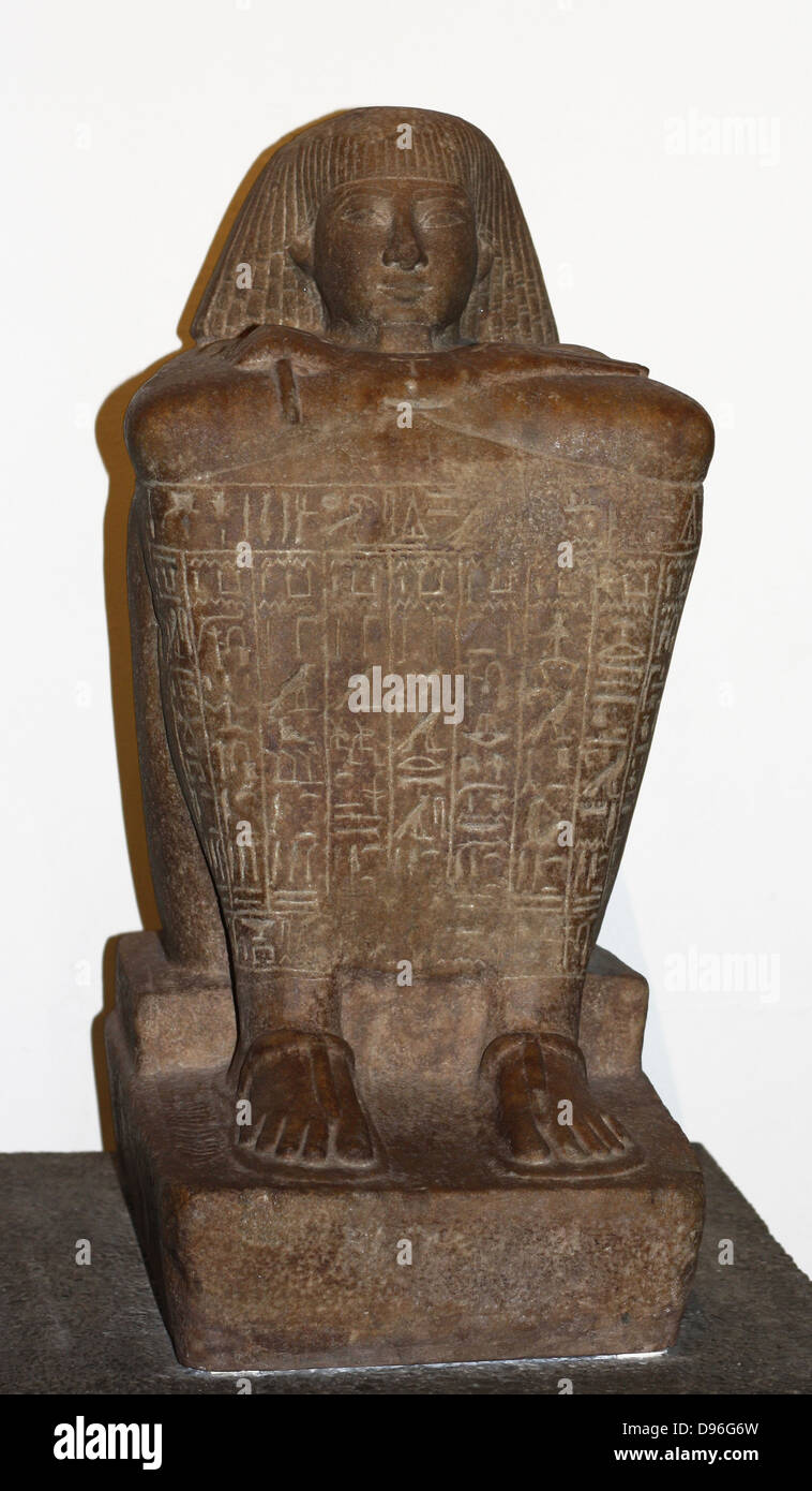 Egyptian block statue of Teti. 18th Dynasty (approx. 1450 BC), probably from Karnak. Teti shown seated on a matt with his feet and arms protruding from a leopard skin coat. Stock Photo