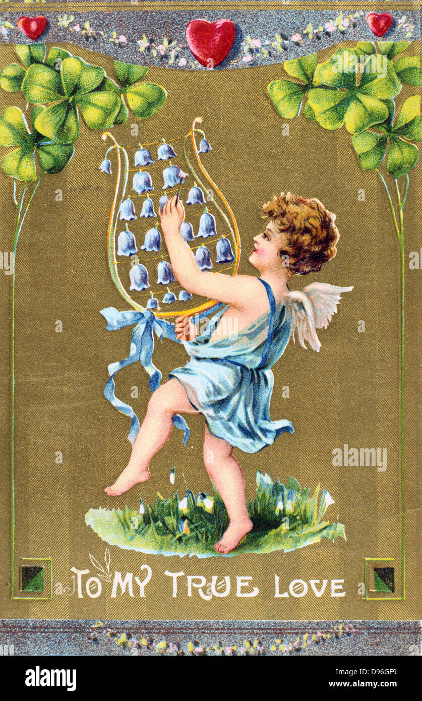 To My True Love, c1910. American Valentine  card.  Cupid dances on grass with naturalised Snowdrops and is playing a lyre of Stock Photo