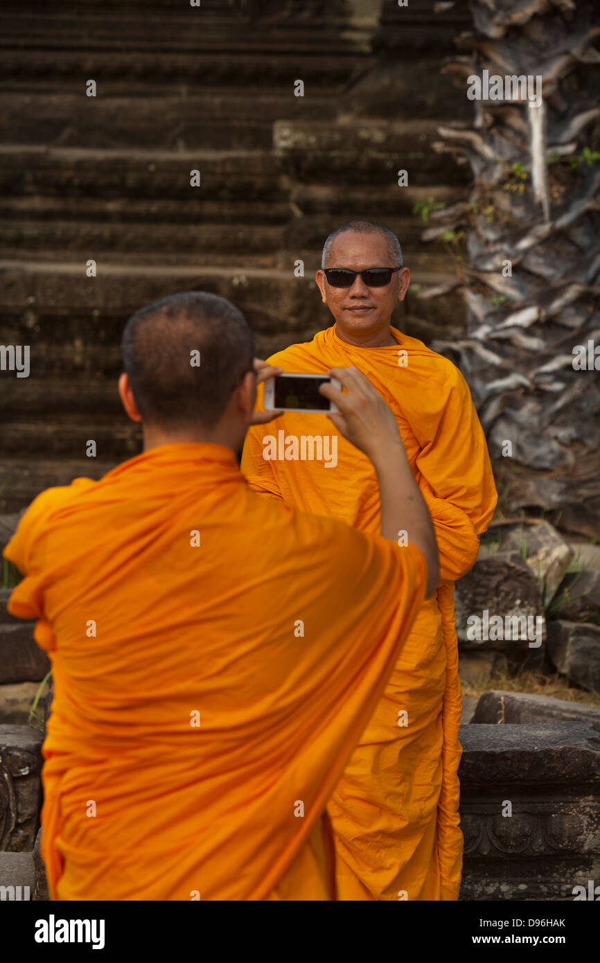 Buddhist monks visiting Angkor Wat, Cambodia Stock Photo